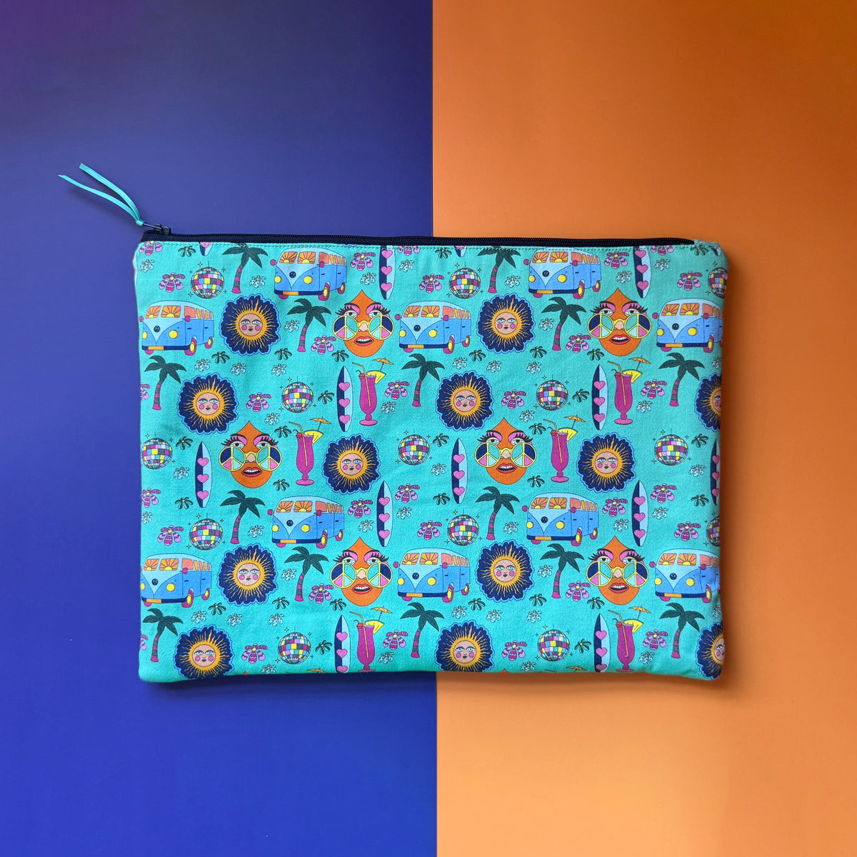 Back of the large turquoise Hippie Pouch, showing its all-over retro print and dark navy with turquoise ribbon pull.