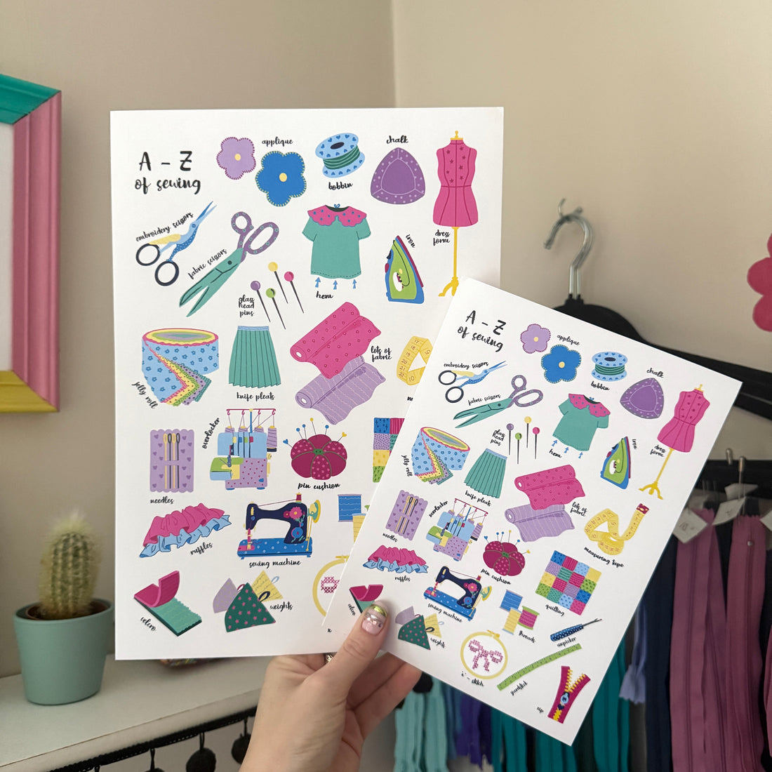 A4 and A5 A–Z of Sewing print in a wooden frame, featuring colourful illustrations of sewing tools, fabric and techniques.