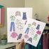  A4 and A5 print with the words ‘There’s nothing better than sewing your own wardrobe’, surrounded by illustrated clothes in pink, green and purple.