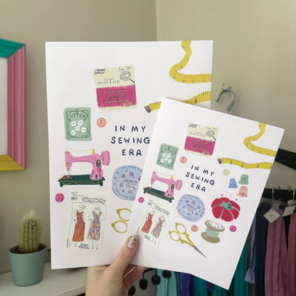  ‘In My Sewing Era’ A4 and A5 print in a  featuring a pink sewing machine and colourful vintage inspired sewing notions.