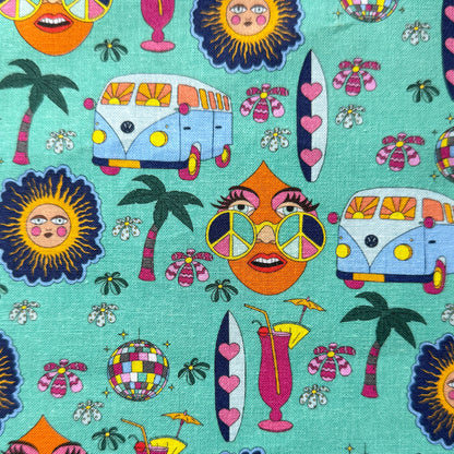 Mint green hippie fabric with blue campervans, sunshine faces, peace-sign sunglasses, palm trees, surfboards and colourful disco balls.