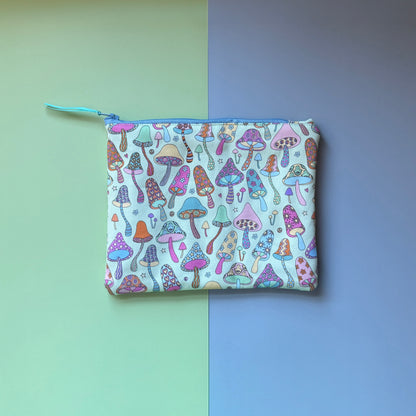  Back of the medium zip pouch, showing colourful illustrated mushrooms on a pale background.