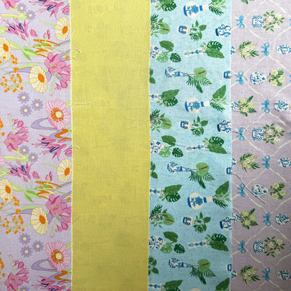 Four fabrics laid side by side, showing pink and yellow retro vintage inspired flowers, plain yellow and two coordinating potted plant prints.